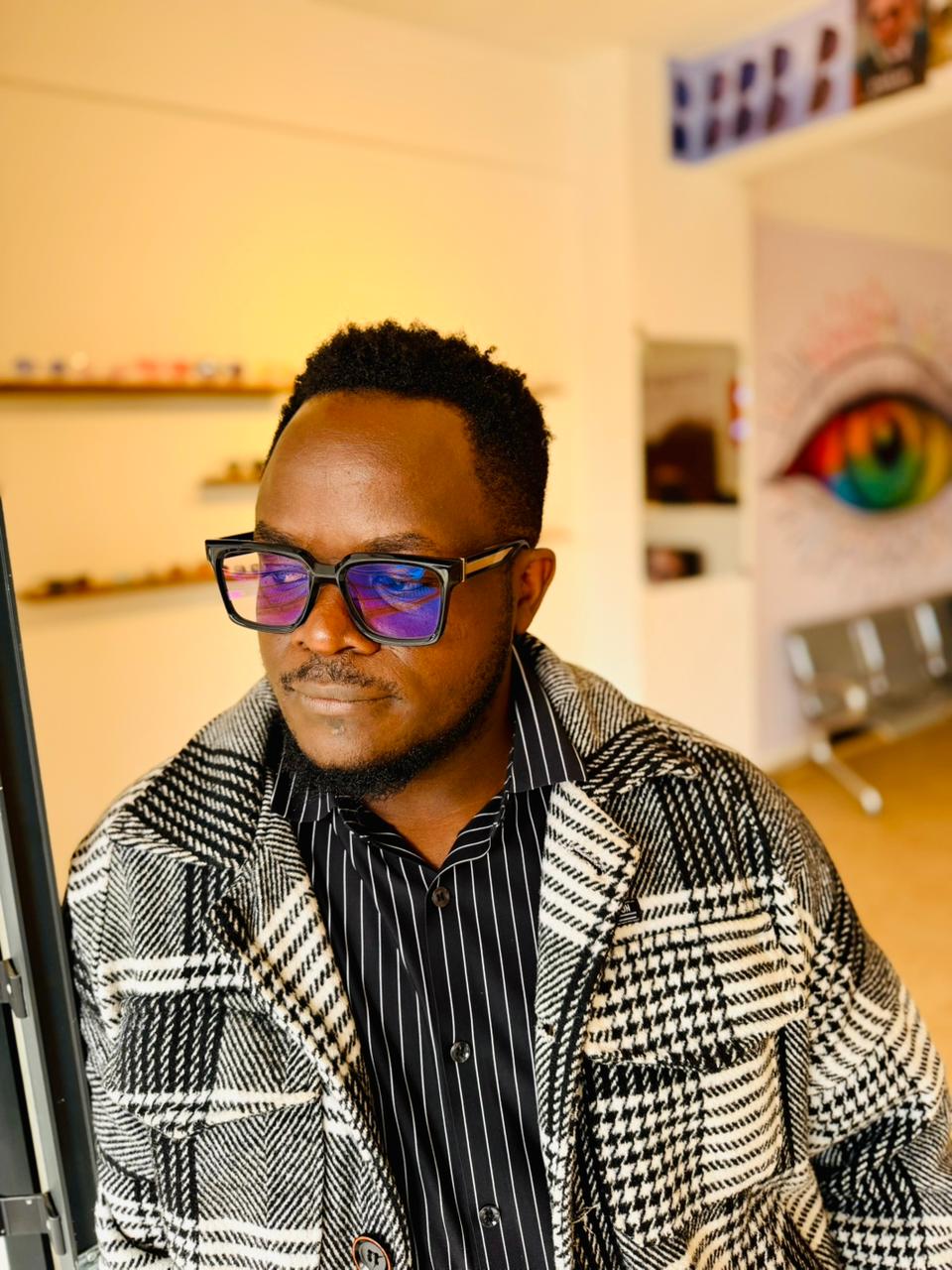 Happy patient wearing single vision glasses at Ottico Eyecare Kenya